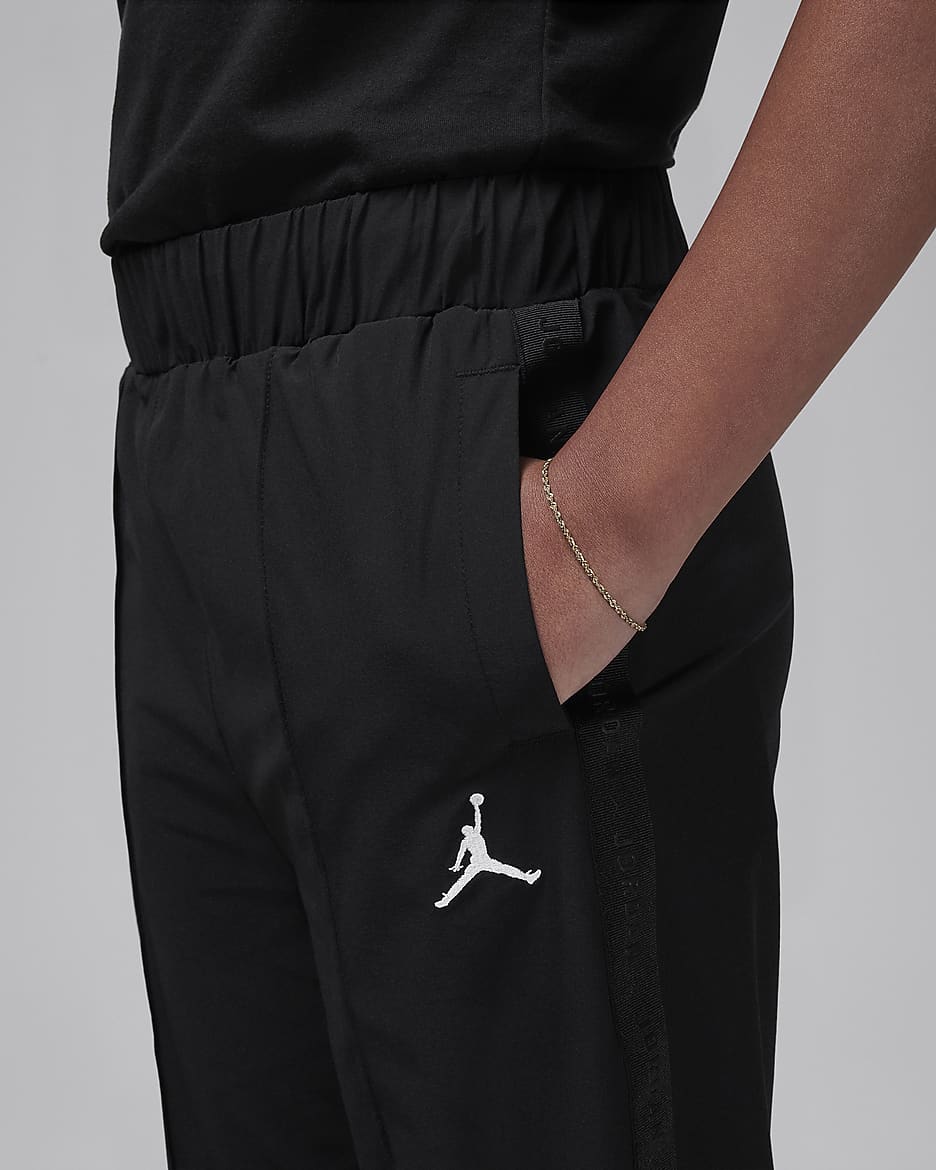 Pants de tejido Woven Jumpman con cinta para nino talla grande Jordan. Nike